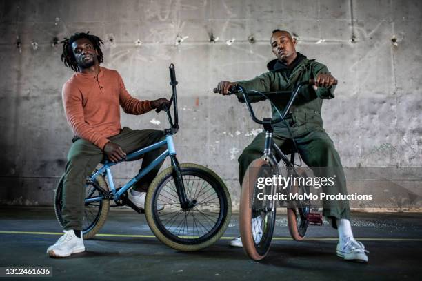 portrait of bmx riders in warehouse environment - bmx cycling 個照片及圖片檔