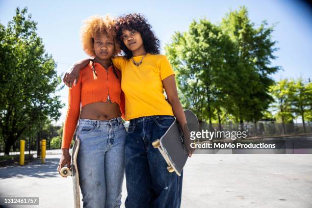 portrait of female skateboarders outdoors - cliqueimages stock pictures, royalty-free photos & images