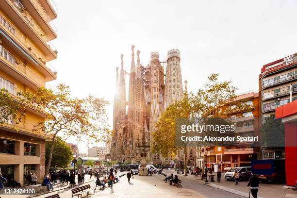 sagrada familia and streets of barcelona, spain - barcelona spain stock-fotos und bilder