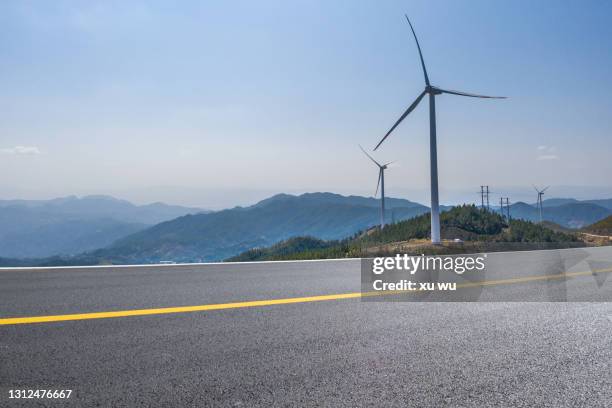 wind power on top of the mountain under blue roadside sky - top of hill parking stock pictures, royalty-free photos & images