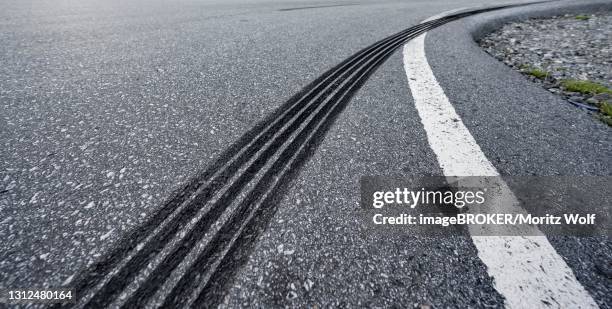 tire tracks on a road, skid marks, norway - skid marks fotografías e imágenes de stock