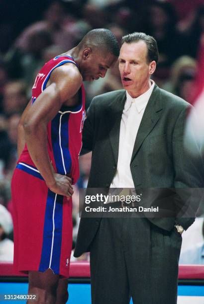 Doug Collins, Head Coach for the Detroit Pistons gives instructions to his Center and Power Forward Theo Ratliff during the NBA Central Division...