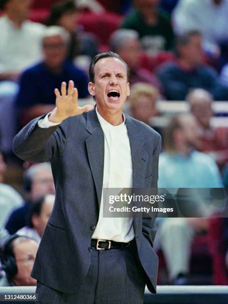 Doug Collins, Head Coach for the Detroit Pistons calls out instructions to his players during the NBA Atlantic Division basketball game against the...