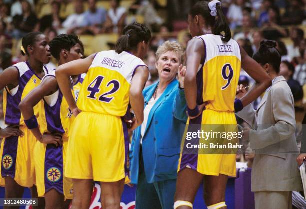 Linda Sharp, Head Coach for the Los Angeles Sparks gives instructions to Center Lisa Leslie and Forward Linda Burgess during the WNBA Western...