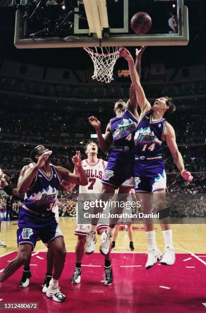 Shandon Anderson, Shooting Guard and Small Forward for the Utah Jazz and team mate Jeff Hornacek challenge for the rebound basketball during Game 5...