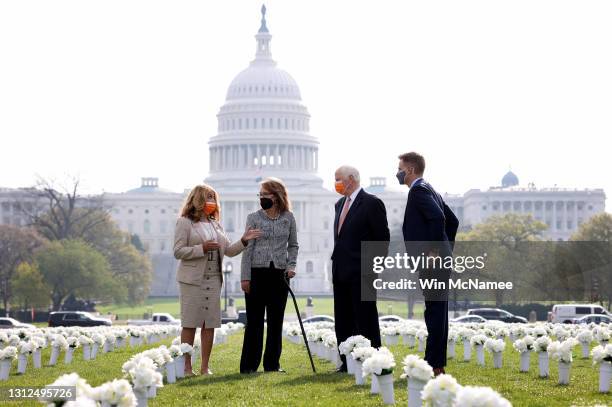 Former Rep. Gabby Giffords , who resigned from Congress due to a traumatic brain injury suffered during an assassination attempt, walks through an...