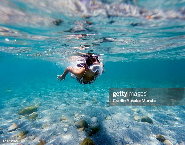 girl swimming in the sea, underwater view - snorkelling stock pictures, royalty-free photos & images
