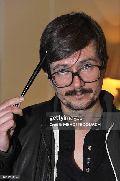 The Charlie Hebdo' s cartoonist Luz shows attends, on November 3, 2011 an editorial conference at the Theatre du Rond-point in Paris, one day after...