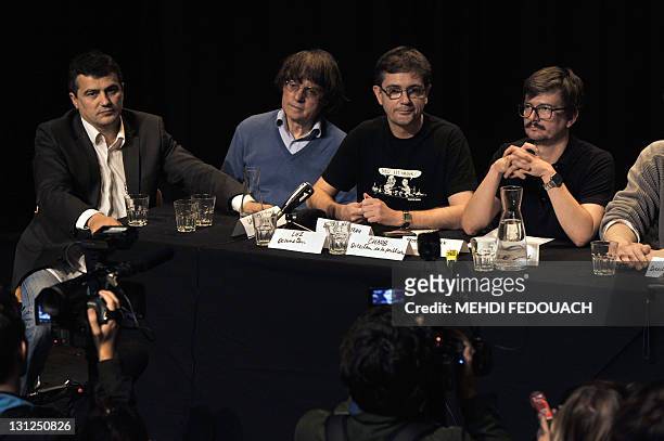 The Charlie Hebdo' s columnist Patrick Pelloux, cartoonists Plantu, Charb, and Luz attend, on November 3, 2011 an editorial conference at the Theatre...