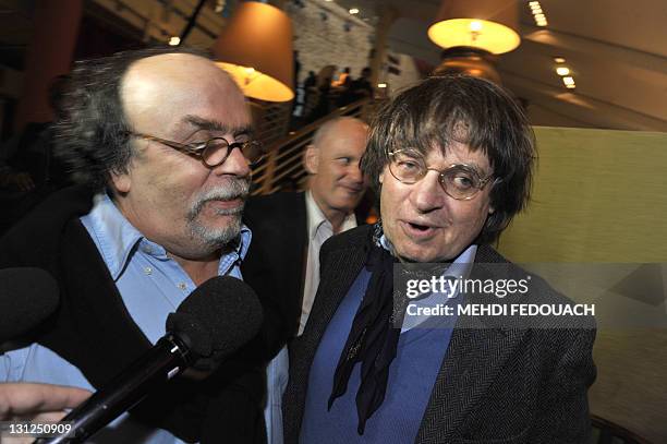 Charlie Hebdo' s cartoonist Plantu talks to theatre du Rond-Point director Jean-Michel Ribes , on November 3, 2011 before an editorial conference at...