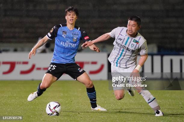 Tatsuki Nara of Avispa Fukuoka and Ao Tanaka of Kawasaki Frontale compete for the ball during the J.League Meiji Yasuda J1 match between Kawasaki...