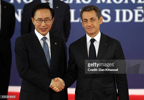 President of Korea Lee Myung-bak is welcomed by the French President Nicolas Sarkozy to the G20 Summit on November 3, 2011 in Cannes, France. World's...