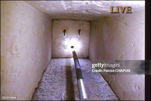 The Queen's chamber in the pyramid of Kheops. The vent though which the Pyramid Rover robot was introduced in 2002. The limestone door and its two...