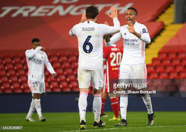 Eder Militao of Real Madrid celebrates victory with team mate Nacho following the UEFA Champions League Quarter Final Second Leg match between...