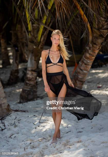 Sophia is seen at the beach wearing black bikini top and sheer skirt on April 14, 2021 in Tulum, Mexico.