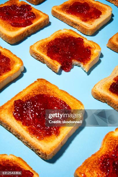 jam on toast bite pop art photo - jam stock pictures, royalty-free photos & images