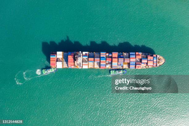 drone point view of large cargo ship in qingdao, shandong, china - full height stock pictures, royalty-free photos & images