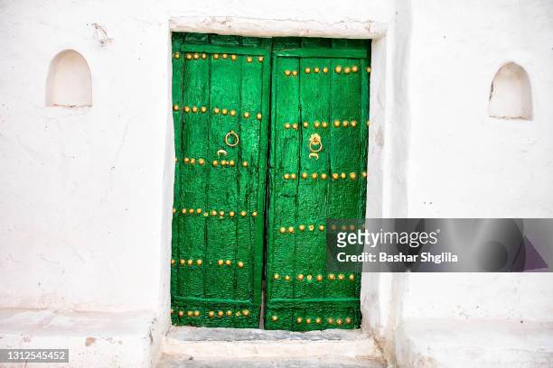 green old door - gadames stock pictures, royalty-free photos & images