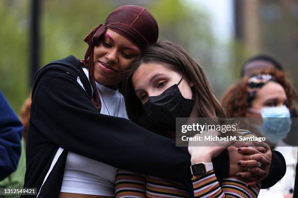 Lubianka Carrillo and Dorothy Maskara embrace during a vigil for Daunte Wright and Dominique Lucious at Washington Square Park in Manhattan on April...