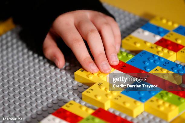 Blind and vision impaired children play with LEGO braille bricks for the first time at Legoland in Chadstone on April 15, 2021 in Melbourne,...