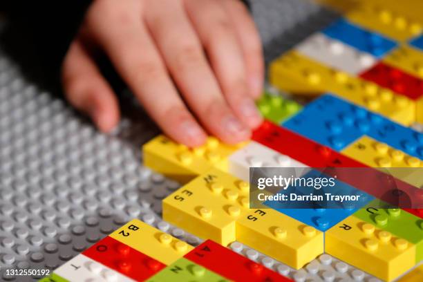 Blind and vision impaired children play with LEGO braille bricks for the first time at Legoland in Chadstone on April 15, 2021 in Melbourne,...