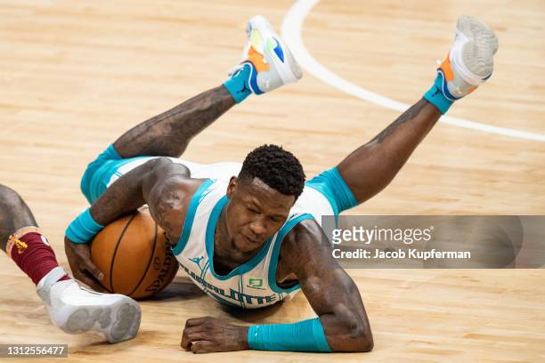 Terry Rozier of the Charlotte Hornets dives on a loose ball in the fourth quarter during the game against the Cleveland Cavaliers at Spectrum Center...