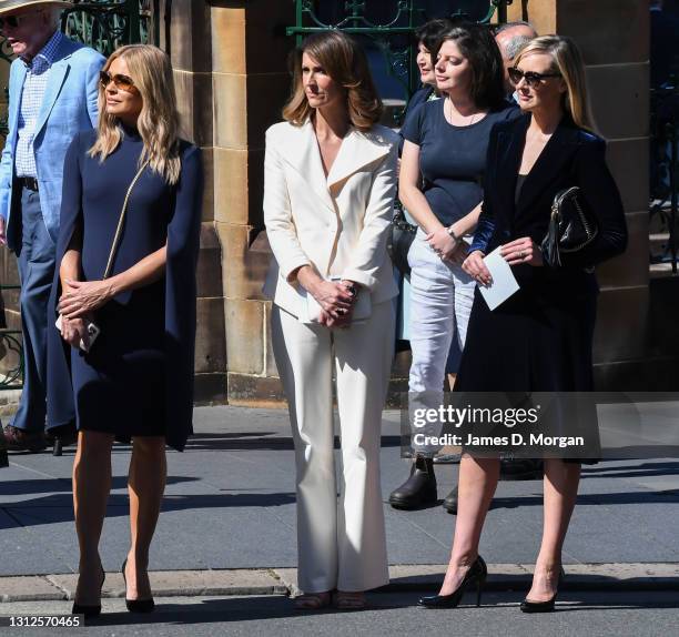 Sonia Kruger, Natalie Barr and Melissa Doyle watch as the hearse departs at the State Funeral for Carla Zampatti at St Mary's Cathedral on April 15,...