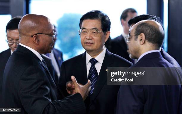 South African President Jacob Zuma, China's President Hu Jintao and Ethiopian Prime Minister Meles Zenawi talk before the first working session at...