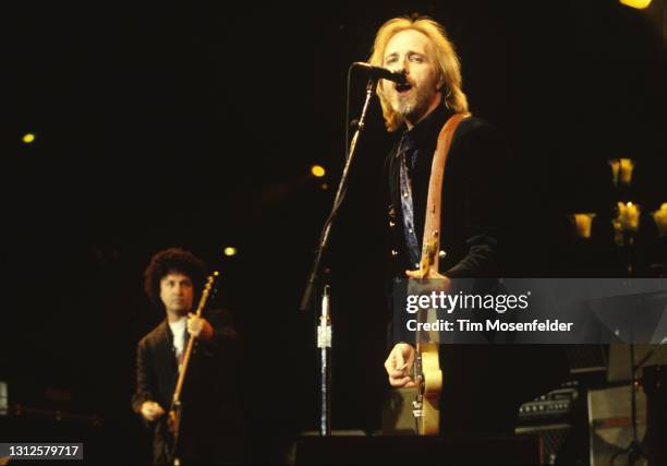 Mike Campbell and Tom Petty of Tom Petty & the Heartbreakers perform at Shoreline Amphitheatre on April 30, 1995 in Mountain View, California.