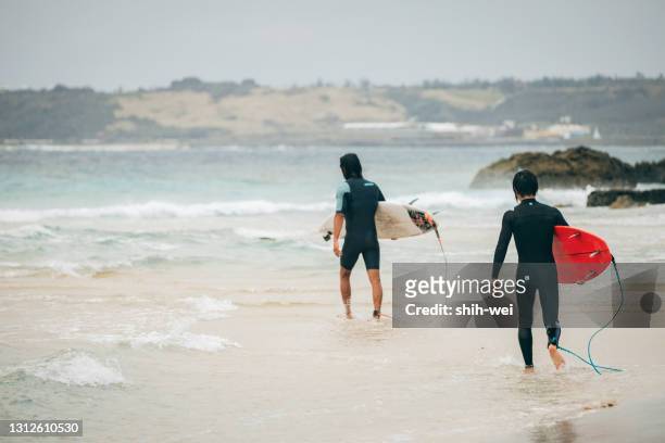 go surfing with friends - taiwan beach stock pictures, royalty-free photos & images
