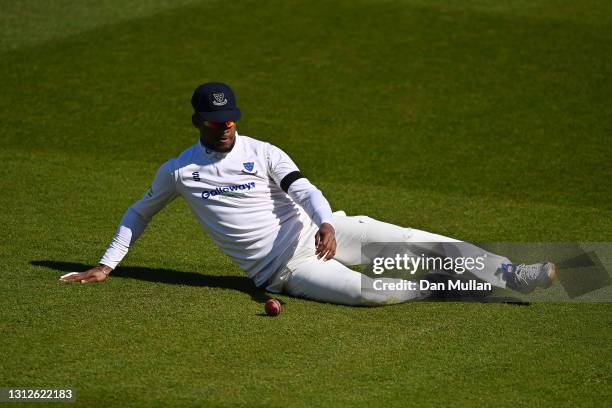 Delray Rawlins of Sussex slides to field the ball during day one of the LV= County Championship match between Glamorgan and Sussex at Sophia Gardens...