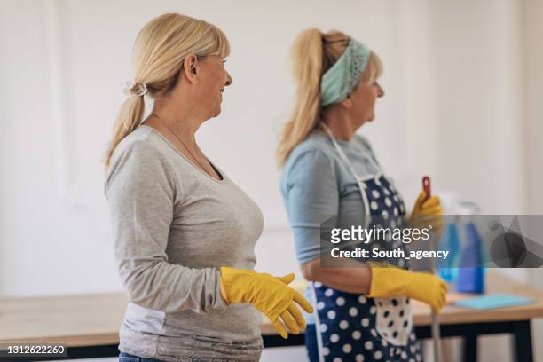 women cleaners - cleaning crew stock pictures, royalty-free photos & images