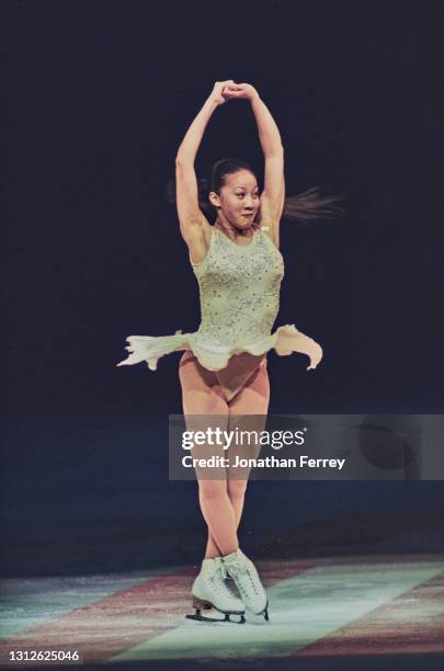 Michelle Kwan of the United States performs an upright spin during the Ladies Figure Skating exhibition at the 1998 U.S. Figure Skating Championships...