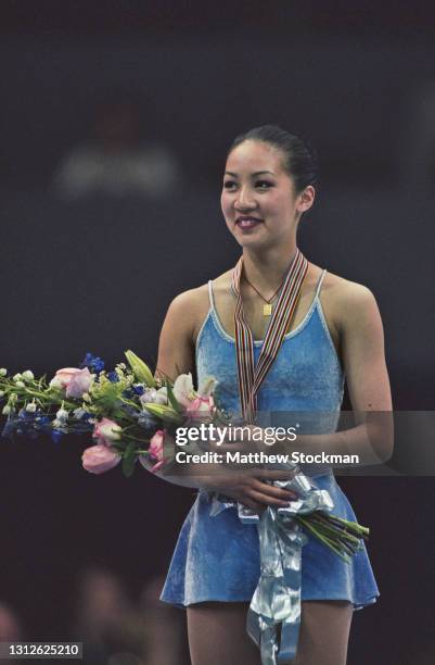 Michelle Kwan of the United States celebrates winning the gold medal in the Ladies Figure Skating Singles competition during the ISU World Figure...