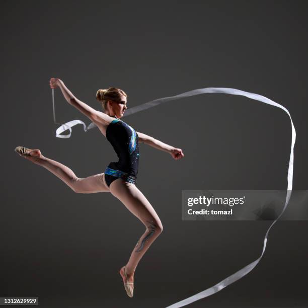 rhytmic gymnastics jump - ribbon dance stock pictures, royalty-free photos & images