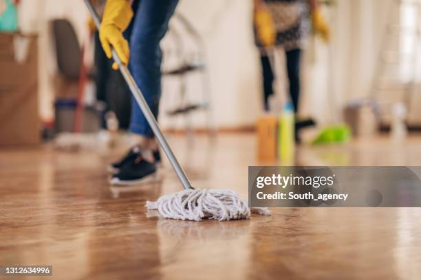 mopping the floor - mop up stock pictures, royalty-free photos & images