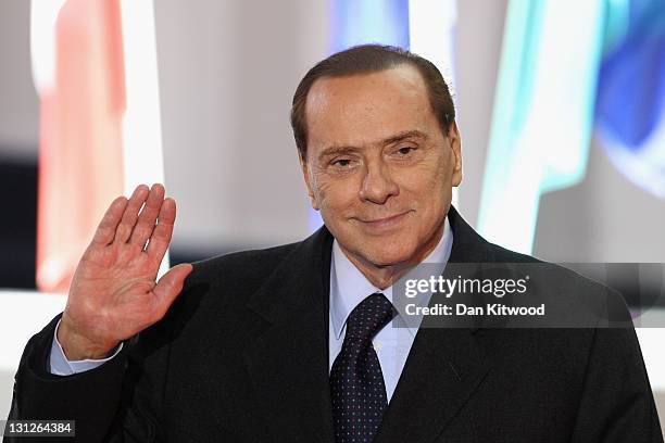 Italian Prime Minister Silvio Berlusconi leaves the conference centre after the first day of the G20 Summit on November 3, 2011 in Cannes, France....