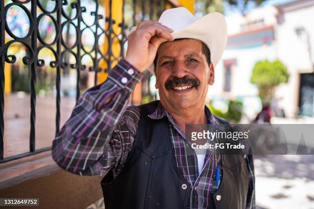 portrait of a senior man - mexican cowboy stock pictures, royalty-free photos & images