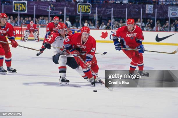 Dimitri Kirilenko, Right Winger for Team Russia and Jason Chimera, Forward for Team Canada during the 1999 International Ice Hockey Federation World...