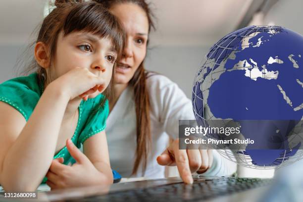 mother helps her daughter in distance education classes - children looking graph stock pictures, royalty-free photos & images