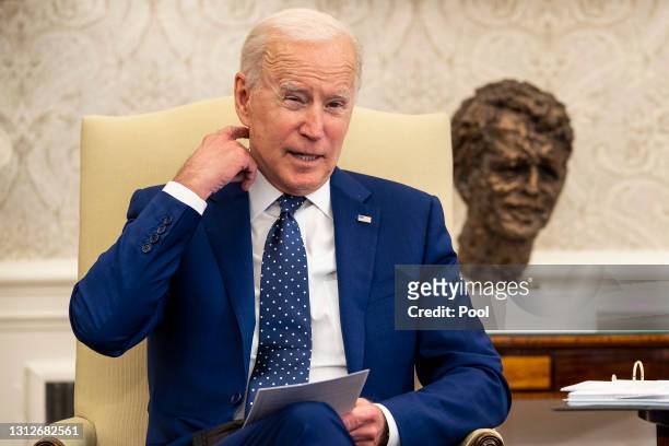 President Joe Biden meets with members of the Congressional Asian Pacific American Caucus Executive Committee in the Oval Office at the White House...