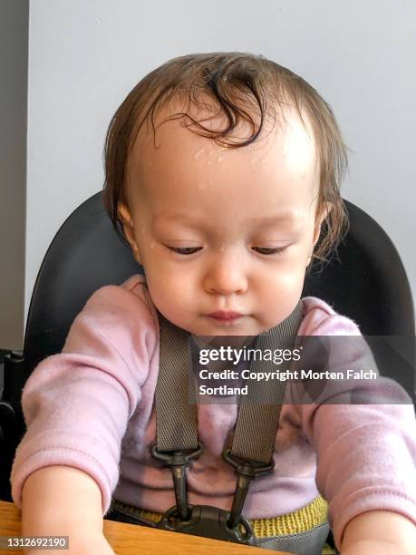 portrait of a child sweating profusely - sweat band stock-fotos und bilder