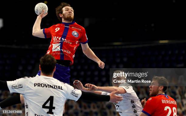 Patrick Wiencek of THW Kiel challenges Alexander Weck of Bergischer HC during the Liqui Moly Handball Bundesliga match between THW Kiel and...