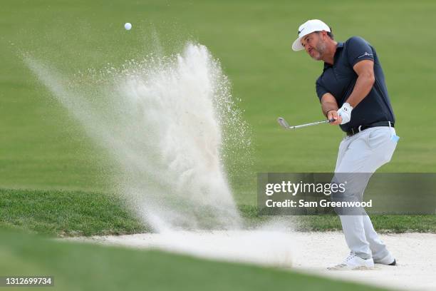 Scott Piercy of the United States plays a shot from a bunker on the fifth hole during the first round of the RBC Heritage on April 15, 2021 at...