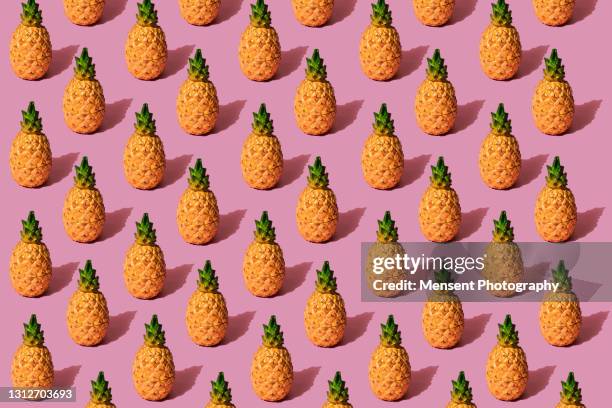 pineapple fruit pattern on a pink background - pineapple pattern stock pictures, royalty-free photos & images