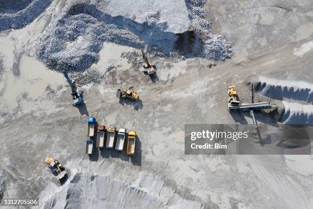 dump trucks on industrial heap, aerial view - gravel stock pictures, royalty-free photos & images