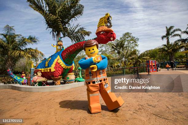 Character Emmet poses for photos at LEGOLAND California on April 15, 2021 in Carlsbad, California. The $19.3 billion U.S. Theme-park industry has...