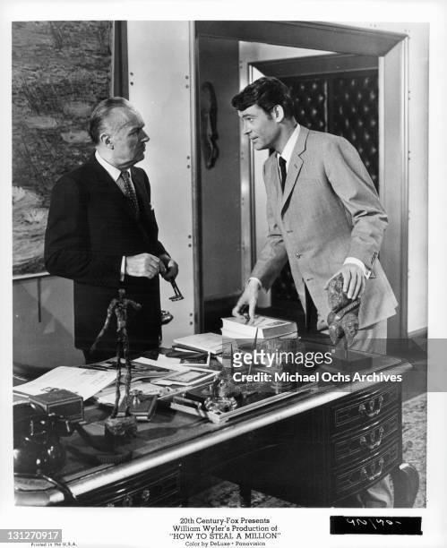 Charles Boyer talking to Peter O'Toole in a scene from the film 'How To Steal A Million', 1966.