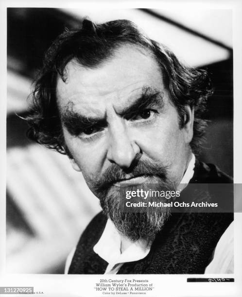 Hugh Griffith, head of a distinguished and wealthy family, is disappointed in his daughter's misunderstanding of his success as a forger in a scene...