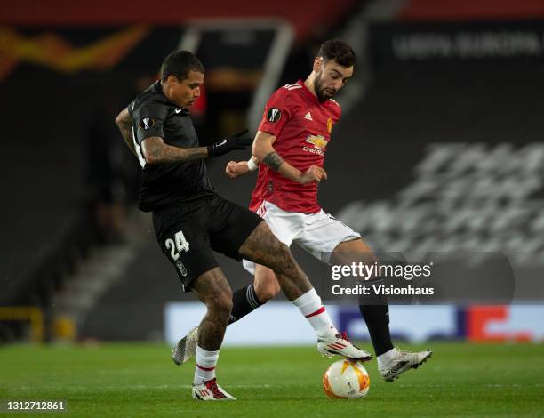 Bruno Fernandes of Manchester United and Kenedy of Granada CF in action during the UEFA Europa League Quarter Final Second Leg match between...